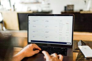 AI-powered audit software running on a laptop, displaying data analysis and financial insights, showcasing the use of artificial intelligence in modern auditing processes.