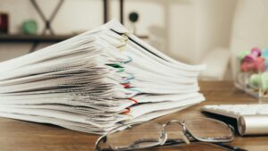 Accountant holding digital documents, emphasizing the importance of digital document management in accounting.