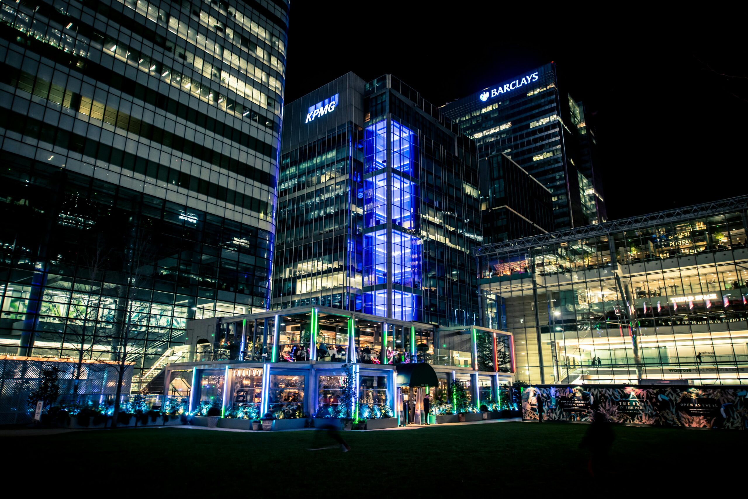 AI technology enhancing tax advisory services at KPMG UK, with digital data analytics visuals and business professionals collaborating on tax strategy