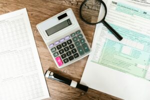 Forensic accountant using advanced technology tools to analyze financial data and detect fraud.