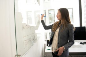 A person analyzing data on a computer screen, representing the use of data-driven technology in marketing and business development for accounting firms.