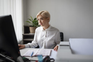 Tax Technology Manager analyzing corporate tax data with automated systems and AI tools.