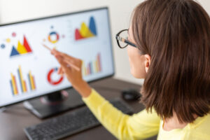 Accounting dashboard metrics displaying revenue, cash flow, and client profitability data on computer screen.