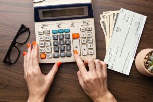 Future of payroll: UK payroll professional reviewing AI-automated payslips and payroll reports