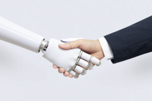 Human hand shaking a robot hand representing autonomous agents in accounting and AI-driven financial automation