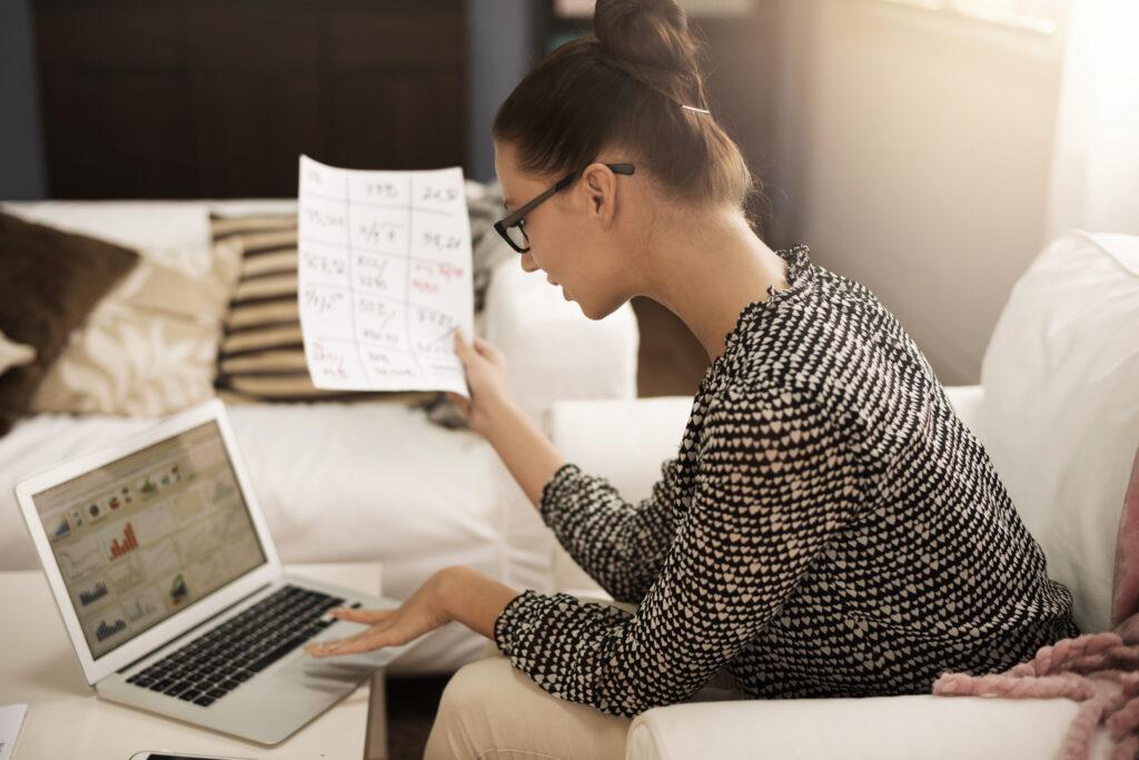 Accountant consolidating ESG data in spreadsheets for sustainability reporting