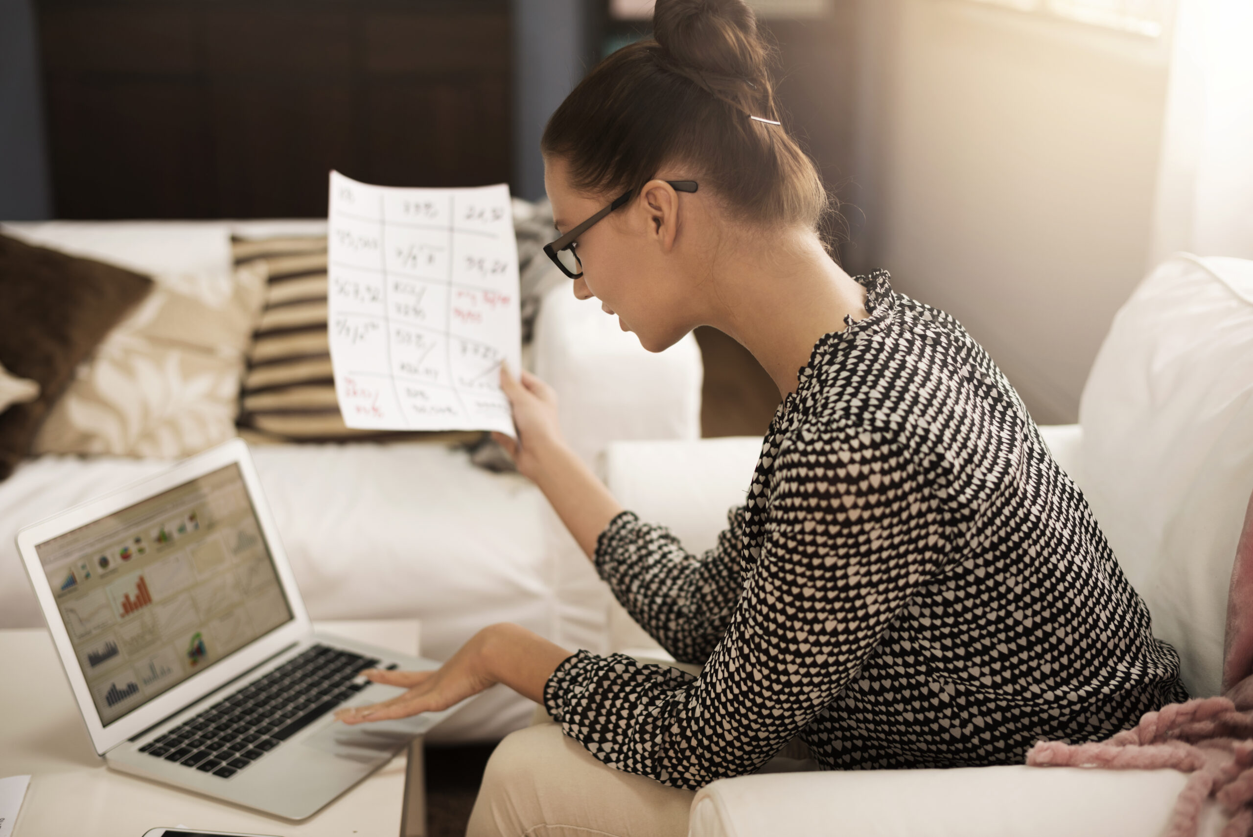 Accountant consolidating ESG data in spreadsheets for sustainability reporting